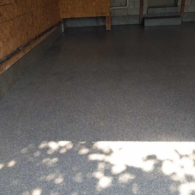 Completed garage epoxy floor by Toronto Concrete Repairs