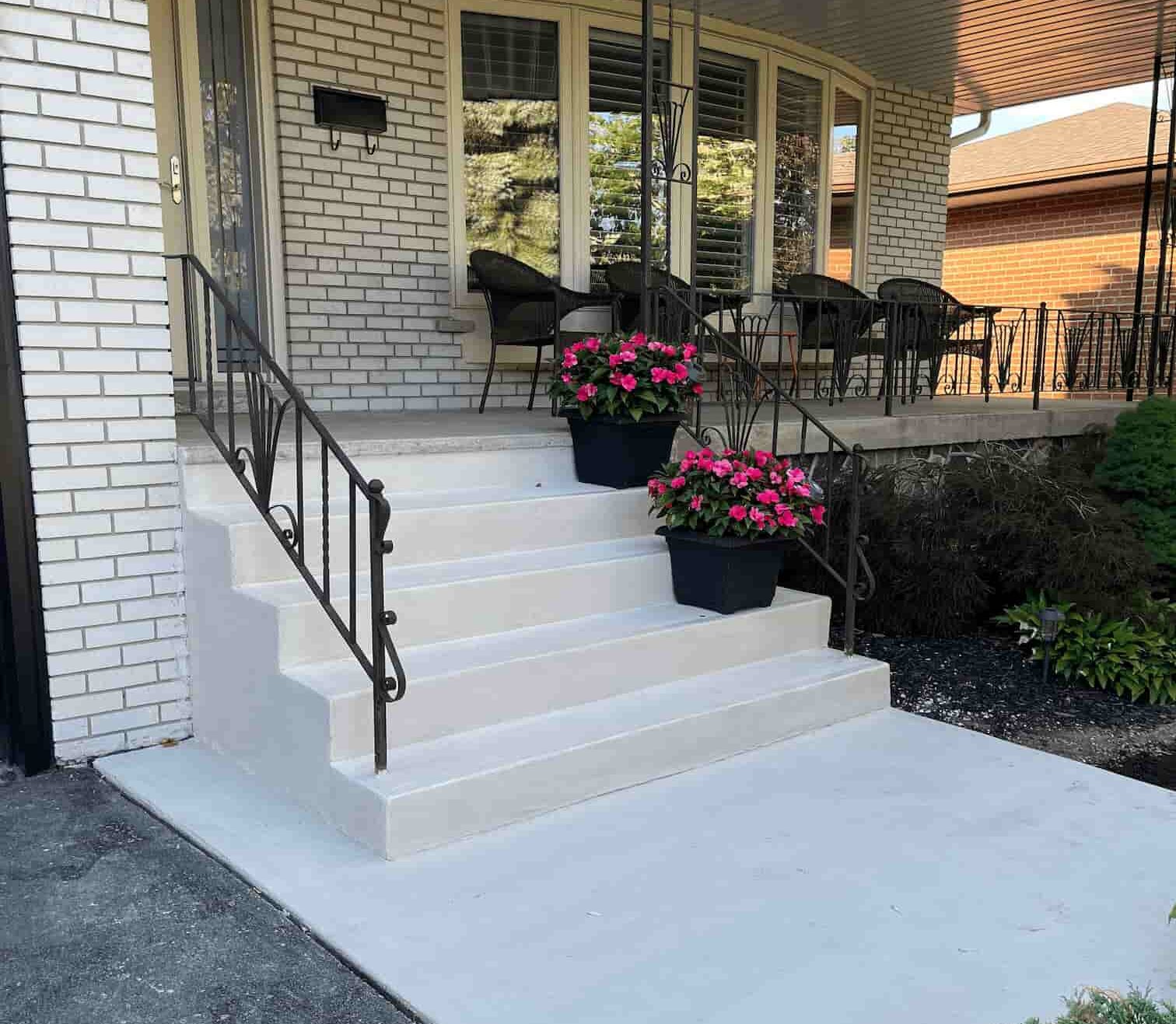 Stamped decorative concrete overlay on porch and steps in Toronto