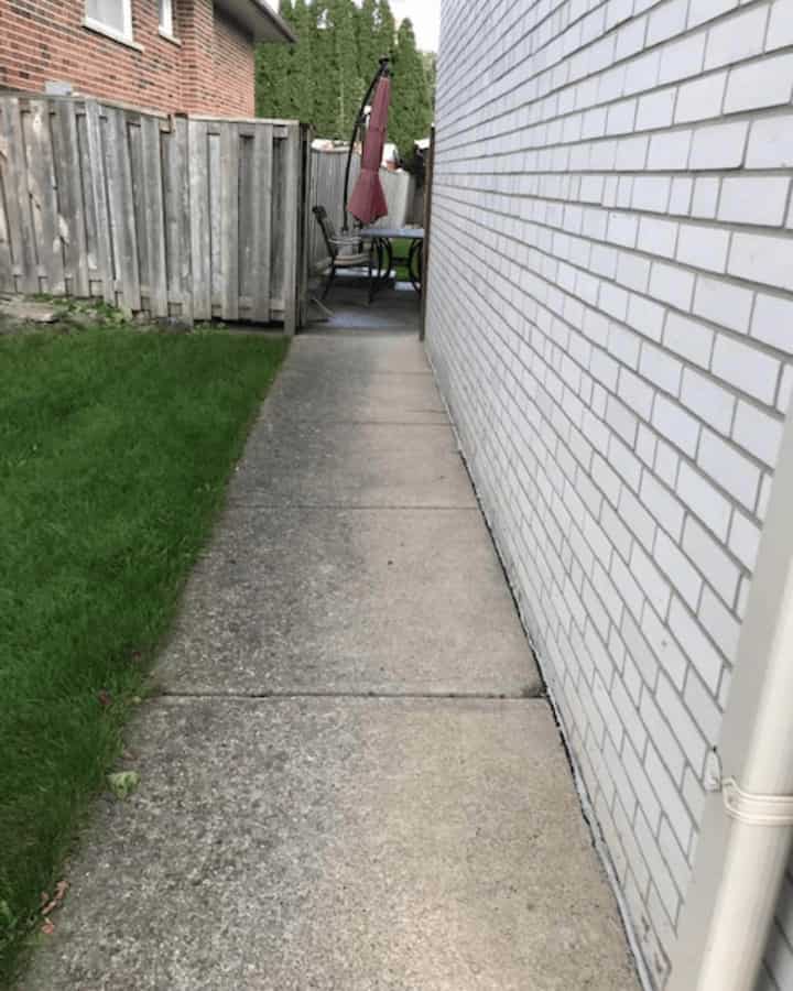 Cracked concrete walkway before repair and overlay, Mississauga