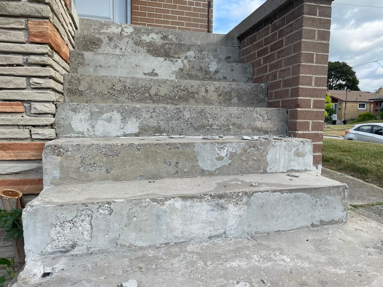 Crumbling concrete porch steps before repair, Toronto